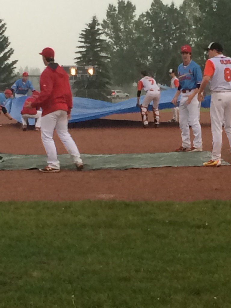 ctlofty's tweet image. Olds and S Albert working together to save the diamond from the rain in Lacombe @BaseballAlberta
