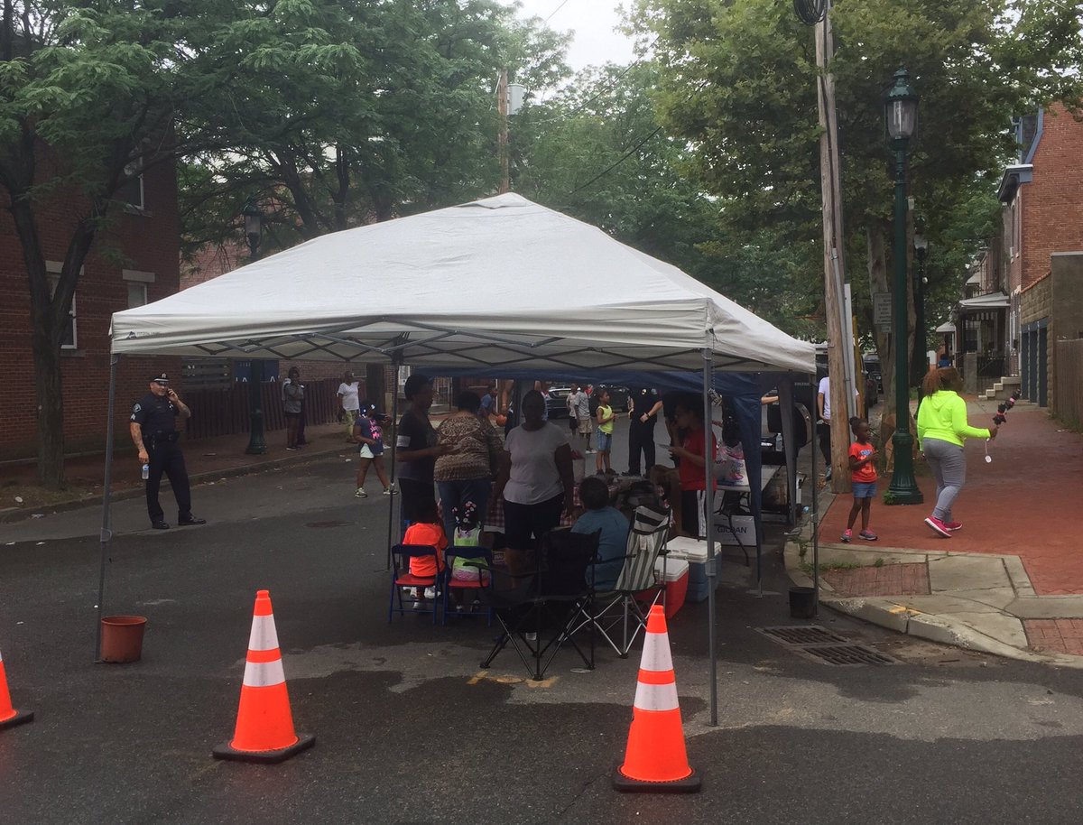 Having fun rain or shine at our pop-up block party in Lanning Square.