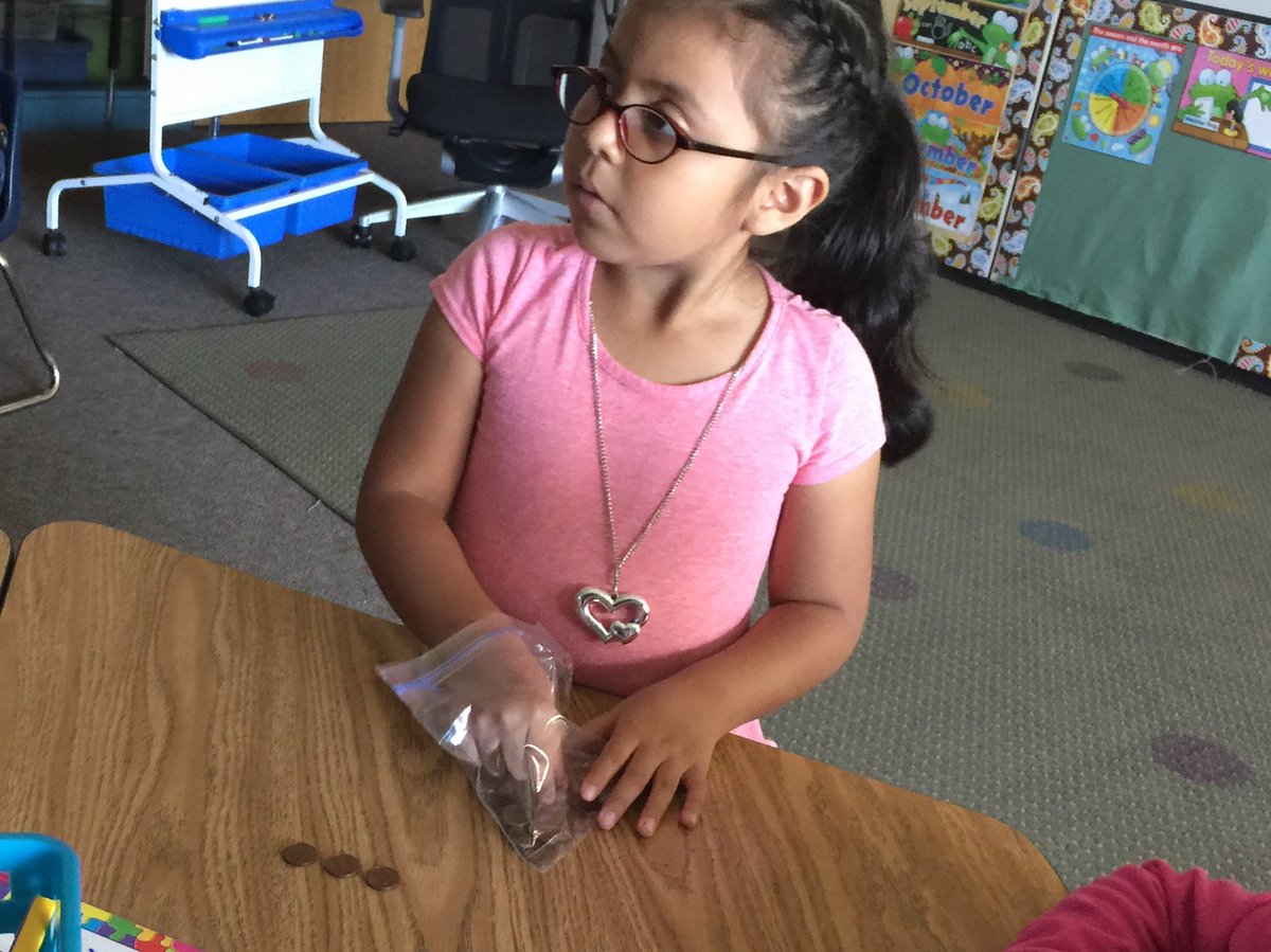 LisaG10615's tweet photo. My little mathematician exploring centavos! #gowo #summermigrantprogram #mathmatters https://t.co/7TM1cnR2Ah