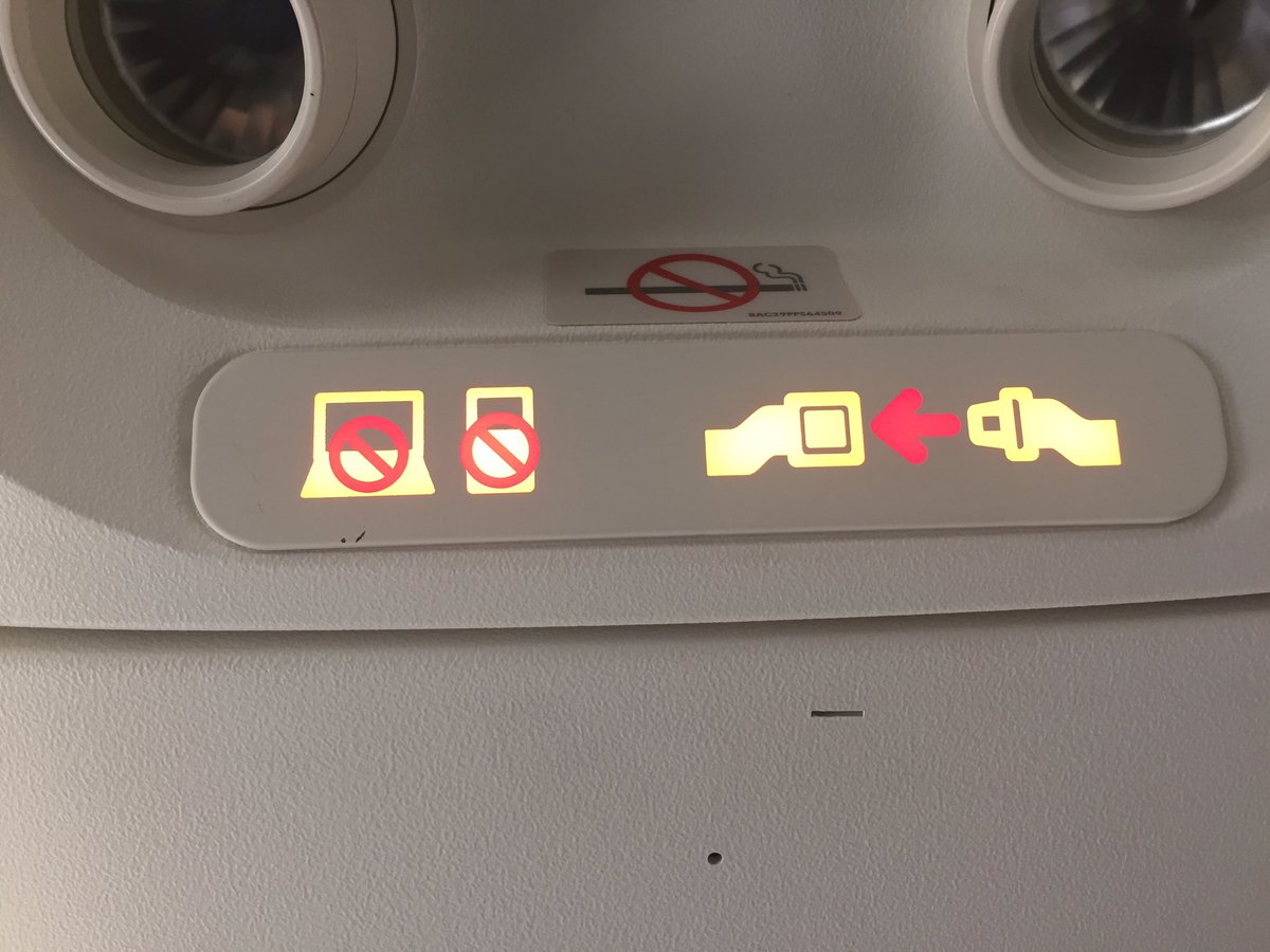 grahamsallan's tweet photo. Finally, a new life for that other on-off sign above your airline seat.  "No electronics" replaces No Smoking. https://t.co/wd3iVclEL2