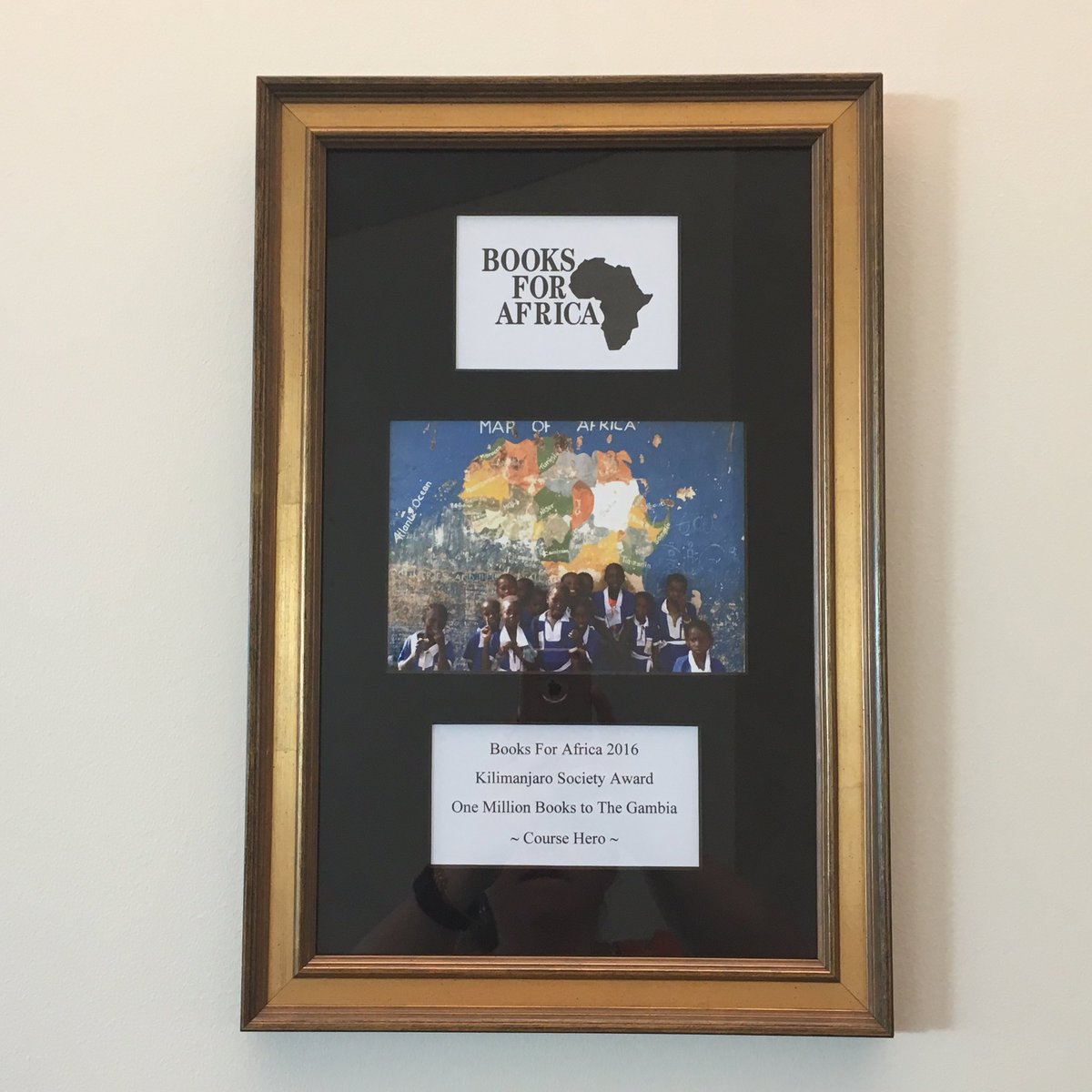 SouthCHKatie's tweet photo. Proudly displaying our Kilimanjaro Society award from @BooksForAfrica at @CourseHero HQ! #KnowledgeDrive https://t.co/nC56qmYRzt