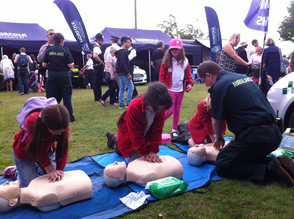 EastEnglandAmb's tweet photo. Children from Roydon Primary now learning CPR. all already know what number to call in an emergency #norfolkshow https://t.co/XR5xZoIaEk