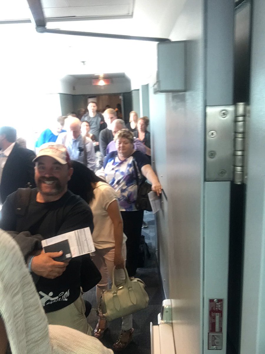 JasonCraine's tweet image. Hey @TorontoPearson - 250 people waiting in a hallway for 20 minutes!! Open the door for FI 601