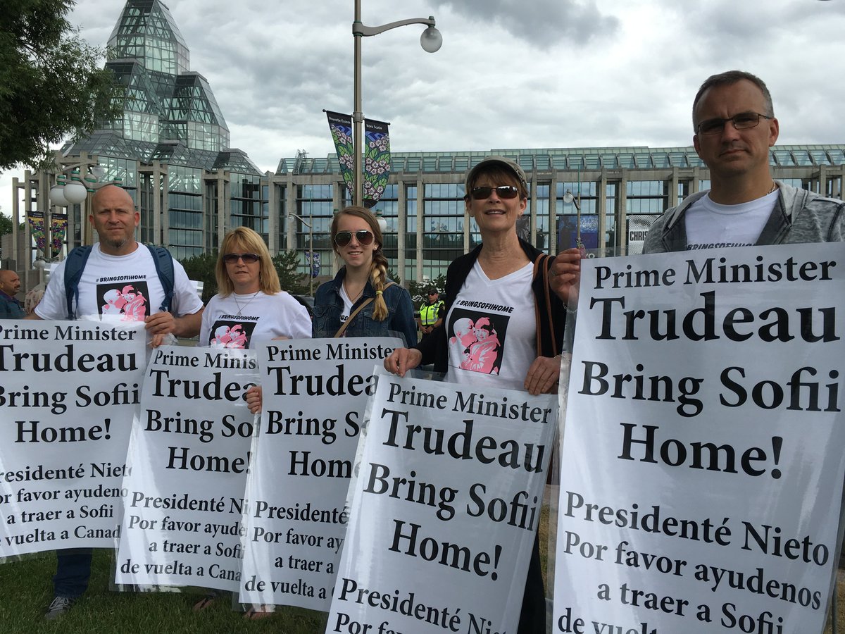 JeffreyStevenD9's tweet photo. Outside National Gallery of Canada with our signs!
@JustinTrudeau @EPN WE ARE HERE!
#BRINGSOFIIHOME https://t.co/x9o1WkKMeZ