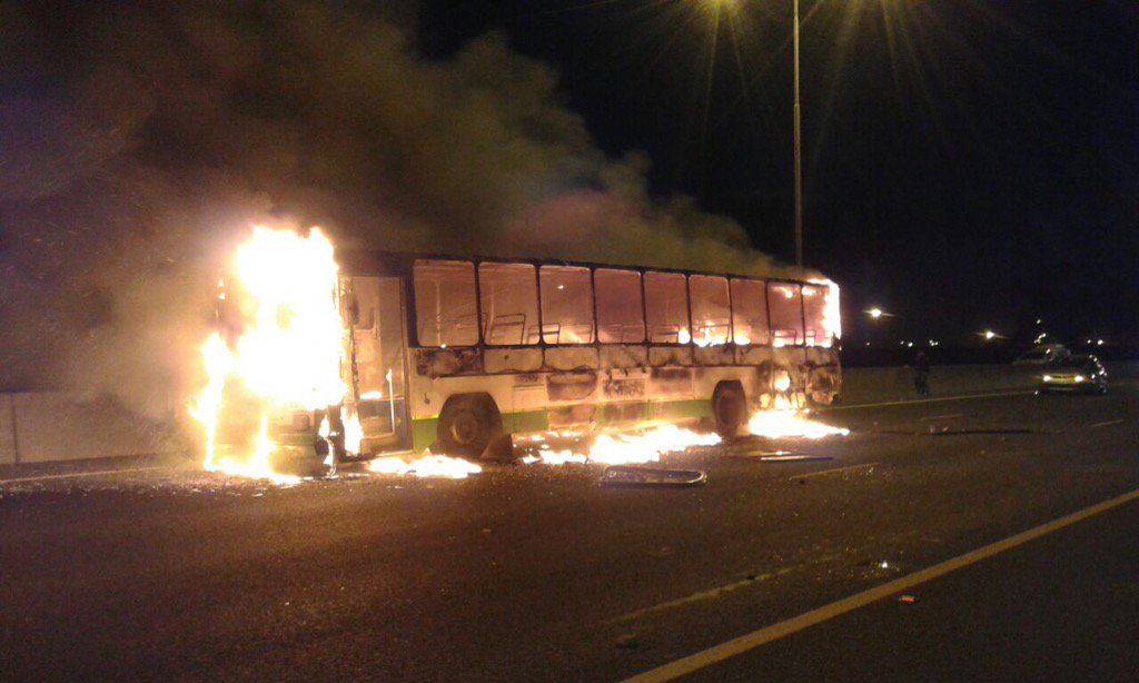 brettherron's tweet photo. 2 GABS buses torched & N2 blocked by ANC members unhappy with ANC candidate nominated for their Ward. #ANCMess https://t.co/XTX6ywwHYy