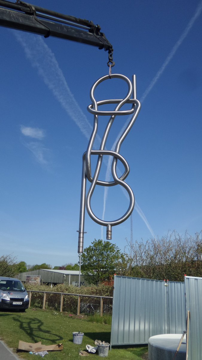 Being hoisted onto it's pedestal