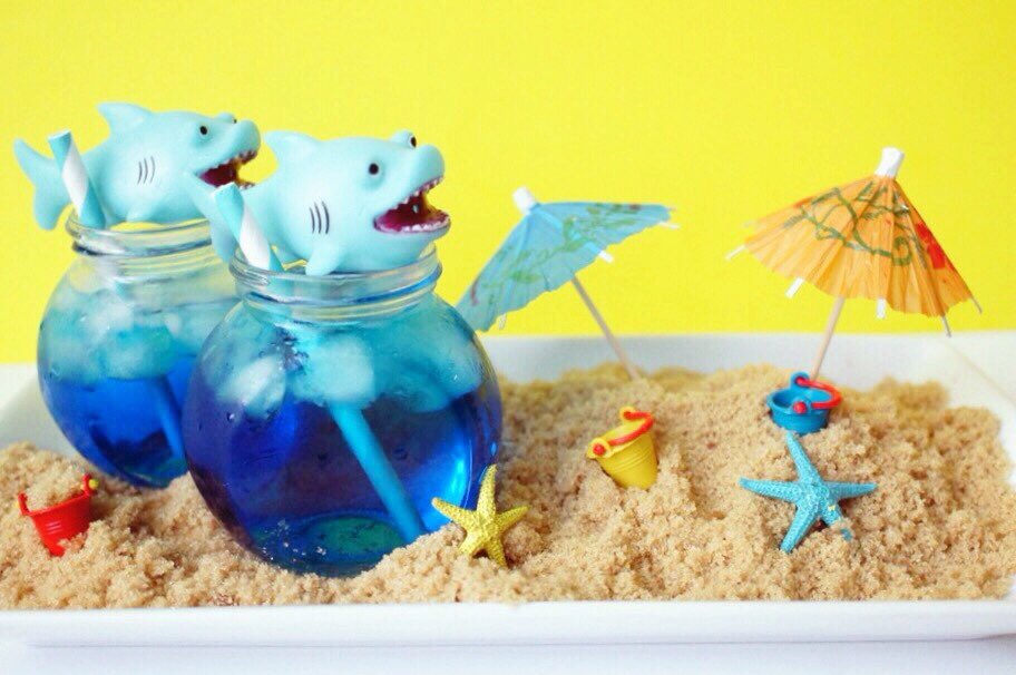 We are taking #sharkweek to the next level with this Sharks on the Beach Cocktail recipe that's on the blog! #🍹 #🌊