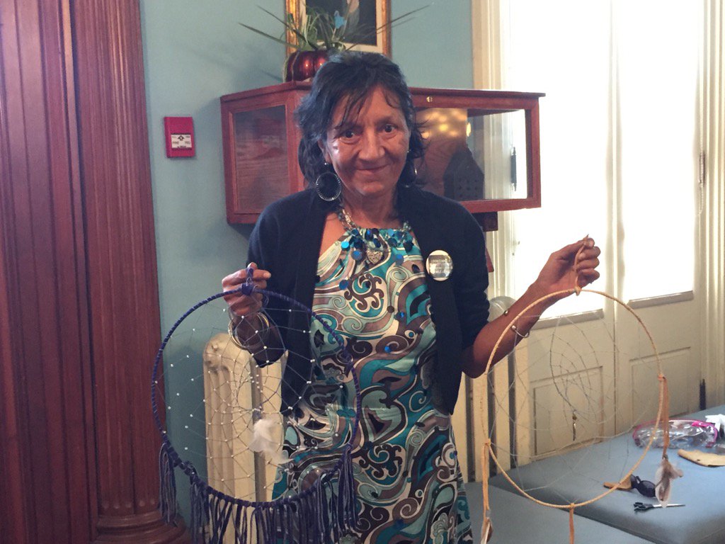 MySistersPlace's tweet photo. Carol with her beautiful hand crafted dream catchers during #NativeAwareness week #LdnOnt @CMHAMiddlesex https://t.co/rtii3f368t