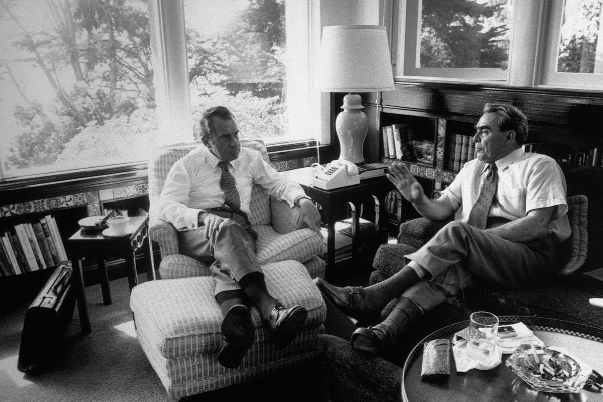 Richard nixon meets with premier brezhnev in the library of the nixon