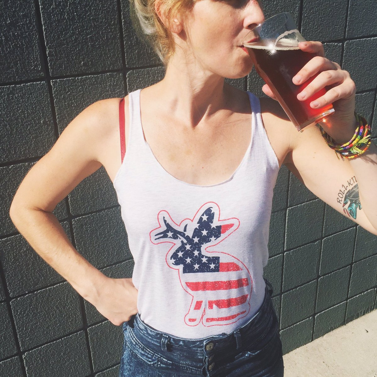 BarJackalope's tweet photo. Kat rocking our newest ladies' tank, just in time for the weekend 🇺🇸 Tonight we'll have @nashburritoco and trivia! https://t.co/GcK2STJyby