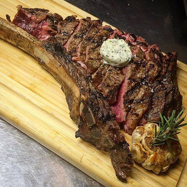 BOASteakhouse's tweet photo. #FourthOfJuly pregame with the 32 ounce, 21 Day Dry Aged, Prime Tomahawk Rib Eye with Garlic Herb Compound Butter. https://t.co/REAjFOdw1f