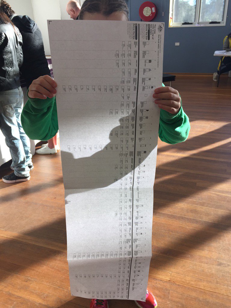 MADSCOO's tweet photo. My 10 year old assistant holds up the long long NSW senate voting papers #ausvotes #australia https://t.co/su340jAy2o