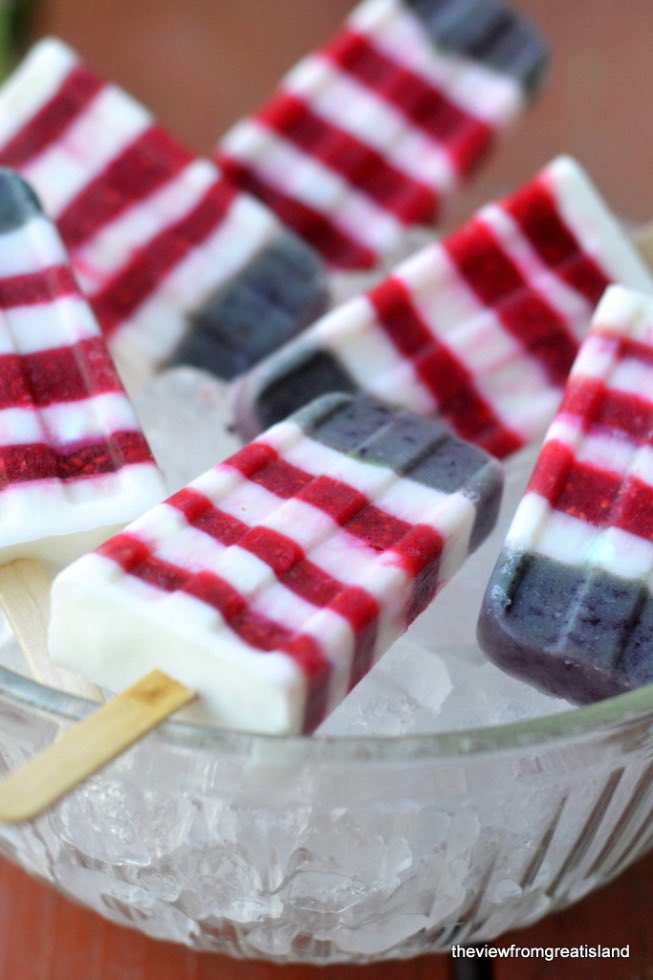Grab fresh ripe blueberries, raspberries and strawberries from the #farmersmarket to make cool #FourthOfJuly pops!