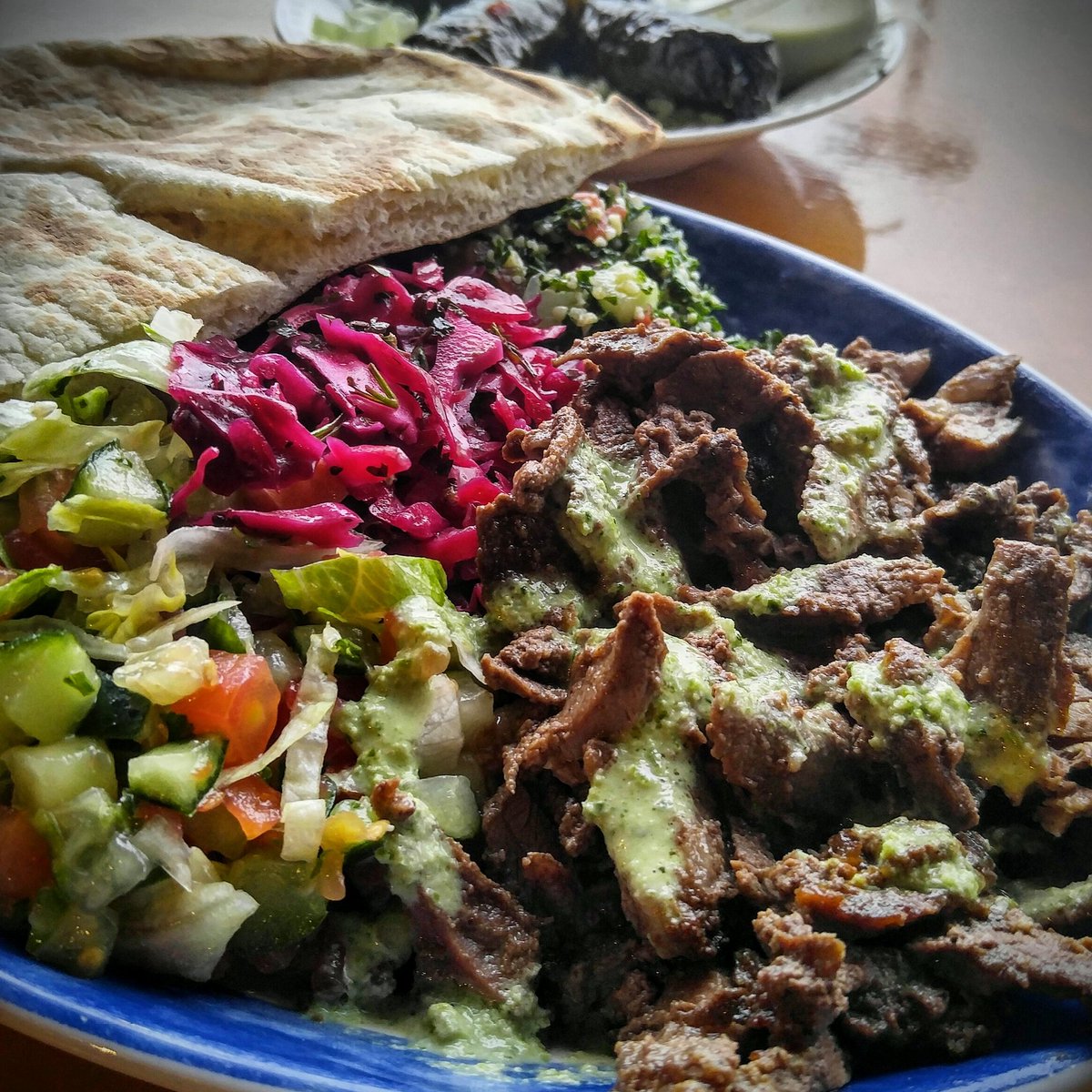 ChrisLeClere's tweet photo. At Yafa Grill enjoying beef shawarma with three salads, rice, and grape leaves. #localtreat #scrummy https://t.co/qSJK3NL9PN