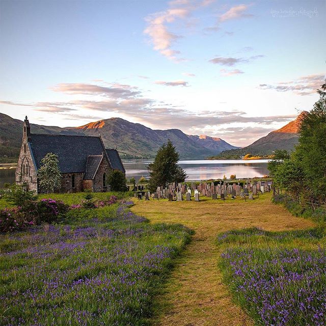 VisitScotland's tweet photo. St. John's Church, Ballachulish with the Pap of Glen Coe just catching the last of the sun 😍  📷 IG/huskidoo https://t.co/2dI1Q0W8OW
