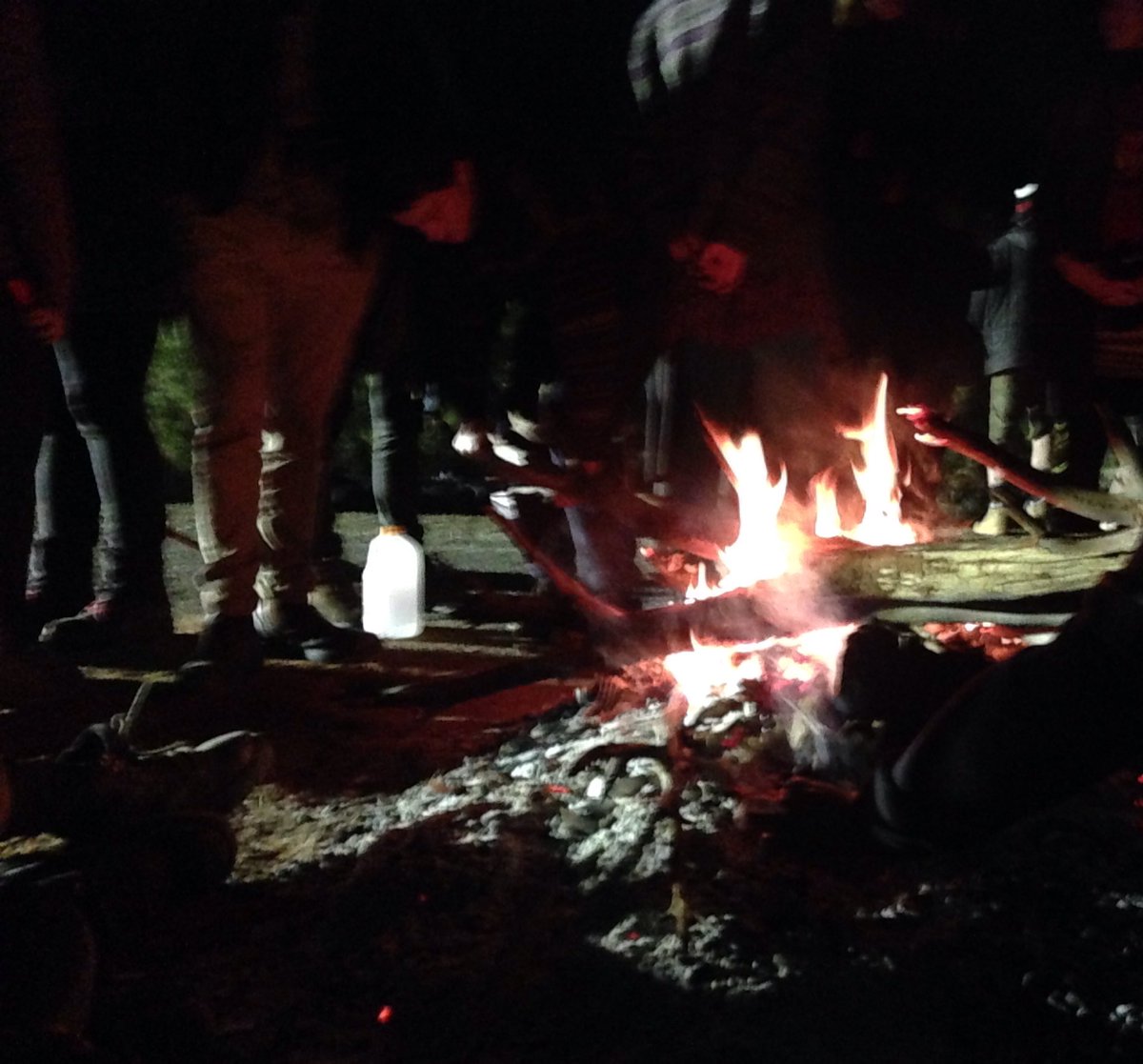philbyevans's tweet photo. Police lights have been brought in and no one looks like moving!!! More wood on the fire too #LizardBitesBack https://t.co/82h7y5Dy9b