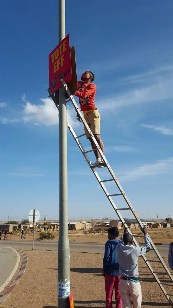 EffNorthwest's tweet photo. Regional Secretary leading the Postering Team on the N12, Matlosana Sub-region. #VoteEFF2016 https://t.co/uTZlPgcbp9