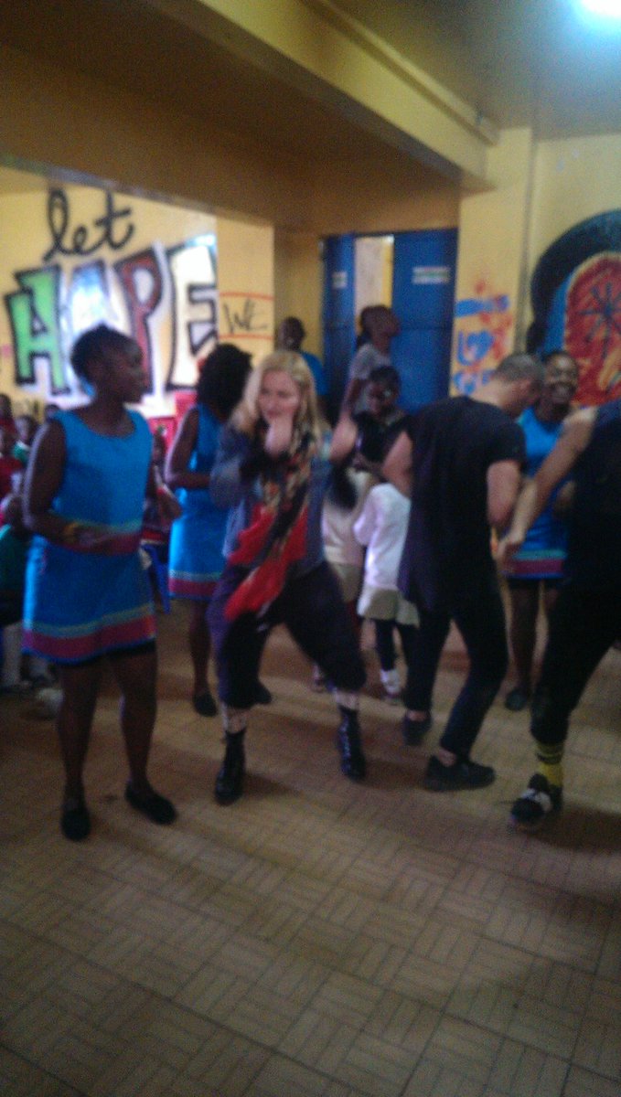 pat_ndegwa's tweet photo. Having a jam session with Madonna in Kibera slum # girlsempowerment #shopco #kenya https://t.co/goesJSfTUt