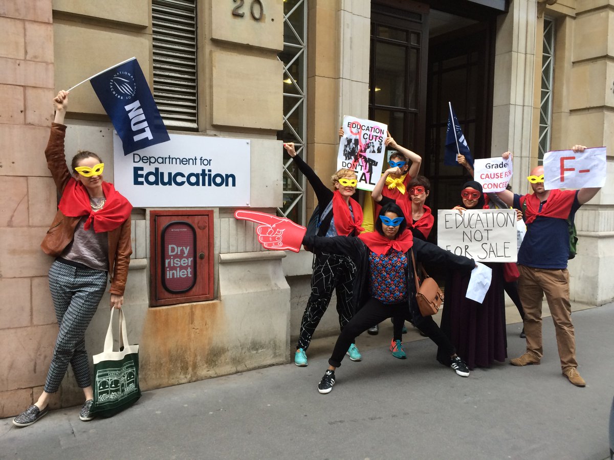 Superhero striking teachers saying #investdontcut  <a href="/educationgovuk/">Department for Education</a> GETS  F minus 4 cutting and selling off schools