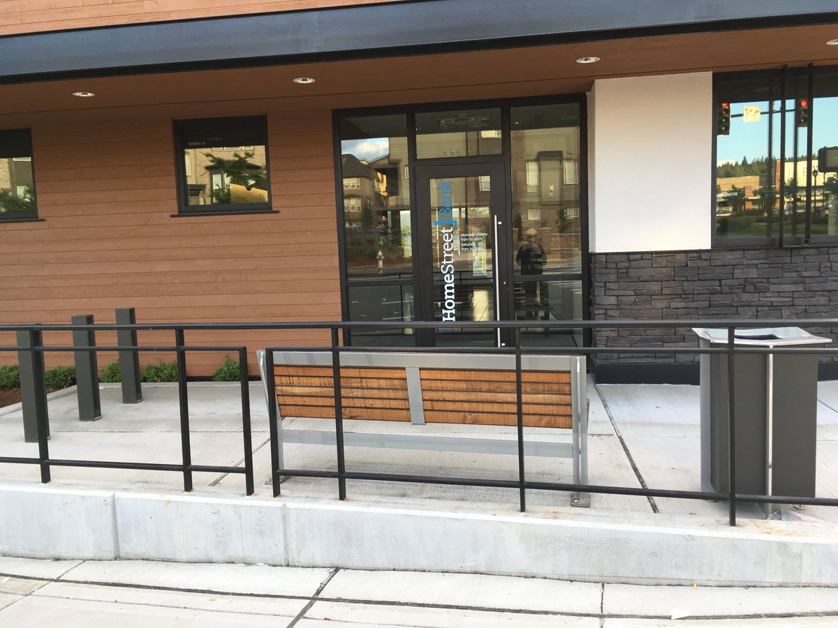 benchesofissy's tweet image. Home Street Bank in the Highlands has this bench for its patrons. Also a fancy trash can and some odd bike racks.