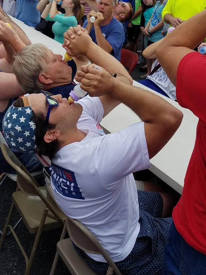 CarneyCampaign's tweet photo. What better way to celebrate Independence Day then to have #TeamCarney's Javi win Lewes's milk drinking competition? https://t.co/aeUm2GToXW