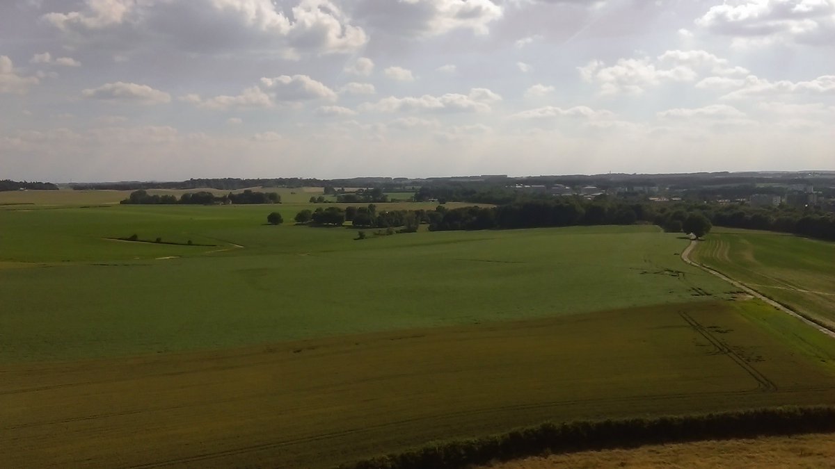 ConflictArchaeo's tweet photo. Glorious view from the Lion Mound in perfect conditions. Hougoumont hiding in centre woodland @DigWaterloo #WU2016 https://t.co/itObIevQY5