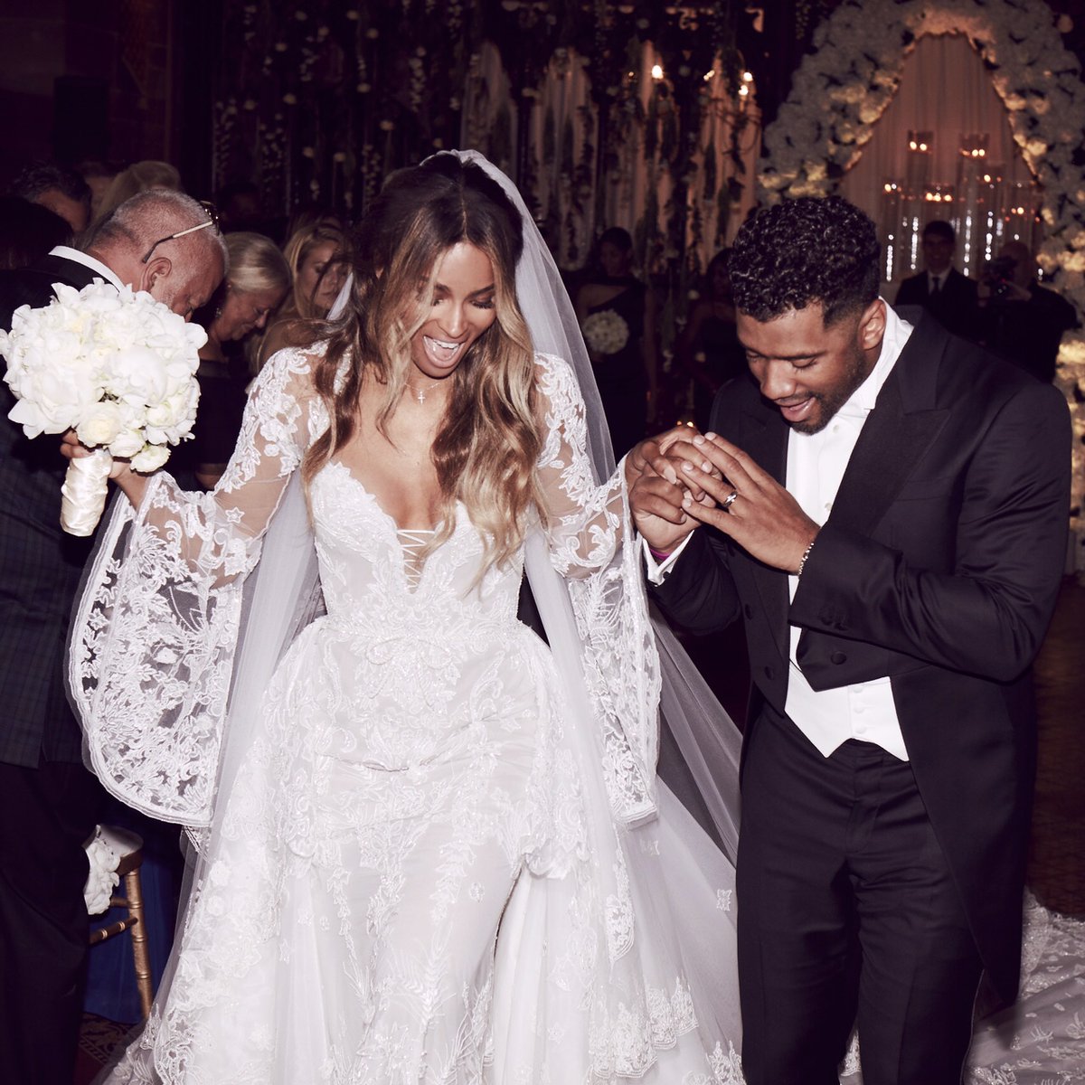 PerezHilton's tweet photo. Here’s the first wedding photo of #Ciara &amp; #RussellWilson! https://t.co/G5RS49yq62 https://t.co/dCVYppoiN2