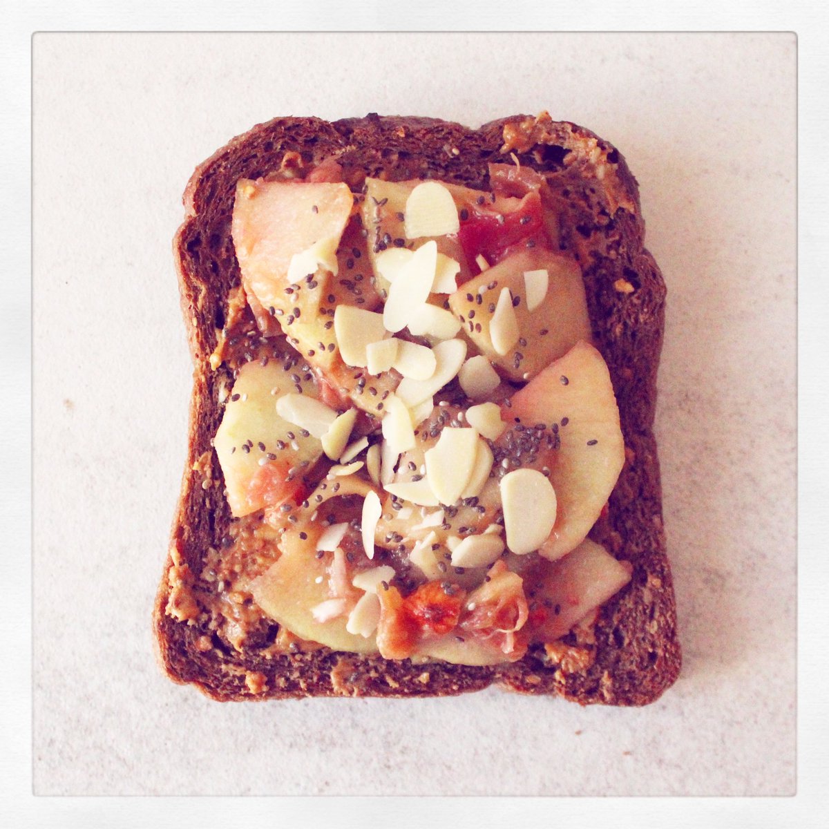 healthylittlek's tweet photo. Fully loaded toast today! Poached apples & rhubarb, @wholeearthfoods peanut butter, flaked almonds & chia seeds! https://t.co/aHQewMzMok
