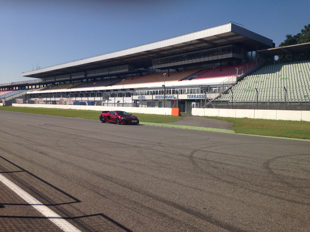 PureMcLaren's tweet photo. A Volcano Red #McLaren650S takes to the Hockenheim track #PureMcLaren https://t.co/B3NeCuexUA