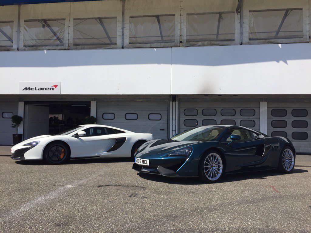PureMcLaren's tweet photo. A #McLaren650S and #McLaren570GT side by side at Hockenheim #PureMcLaren https://t.co/c4wAcPFwl0