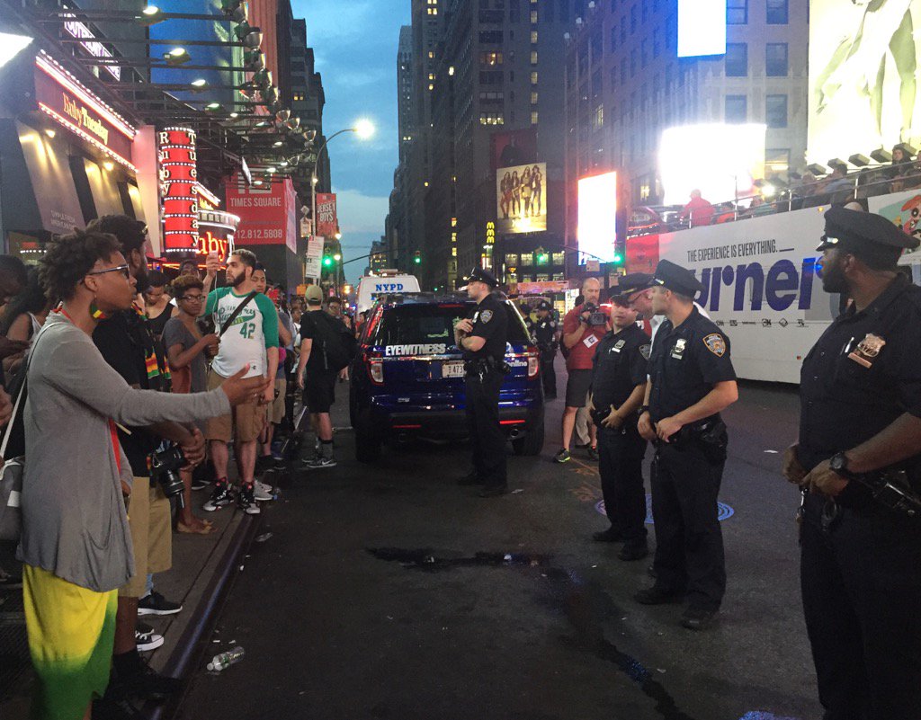 MathisWilliam's tweet photo. "Who do I call when I'm scared of you?" Protester asks NYPD in Times Square at #BlackLivesMatter protest https://t.co/v8KlFj9nF5