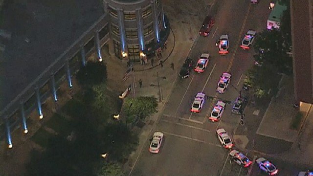 FOX4's tweet image. #BREAKING: An officer on scene confirms at least two Dallas police officers have been shot.