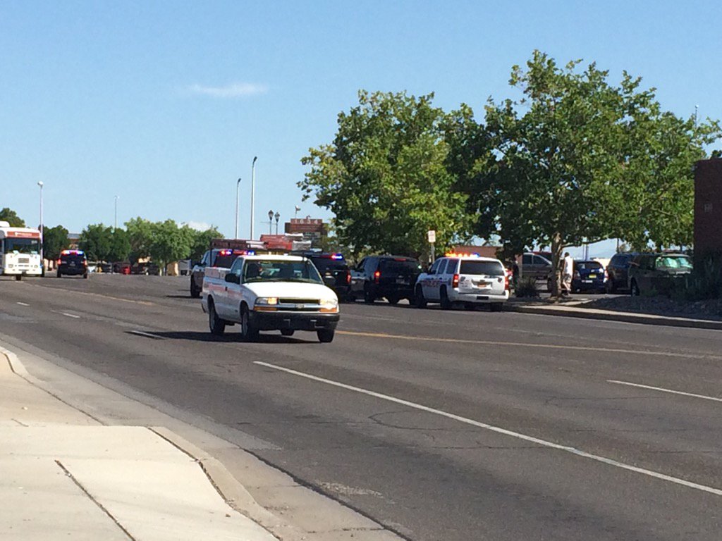 CandaceKRQE's tweet photo. This was the scene at Univ and Indian School. Man w gun taken into custody. Intersection back open. Details at noon. https://t.co/lJma9Ndm1G