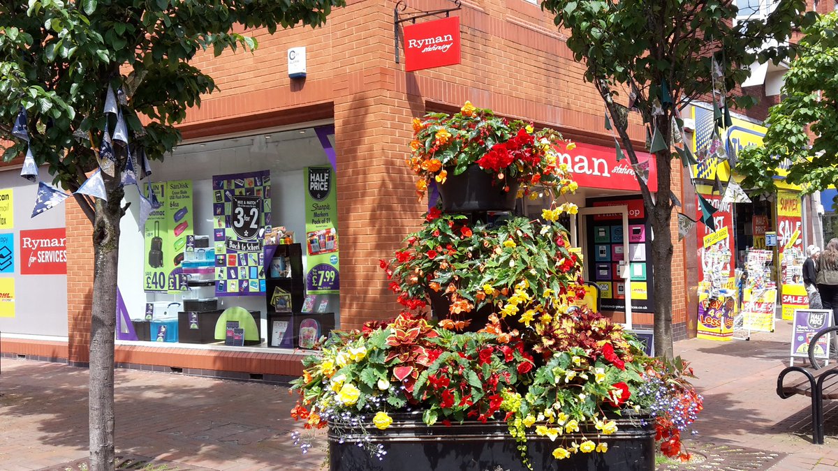 WilmslowInBloom's tweet photo. The @OakNurseries @WilmslowTC tiered planters are really filling out now in #Wilmslow Lovely WI made bunting too https://t.co/aiWm0oZ1Ms