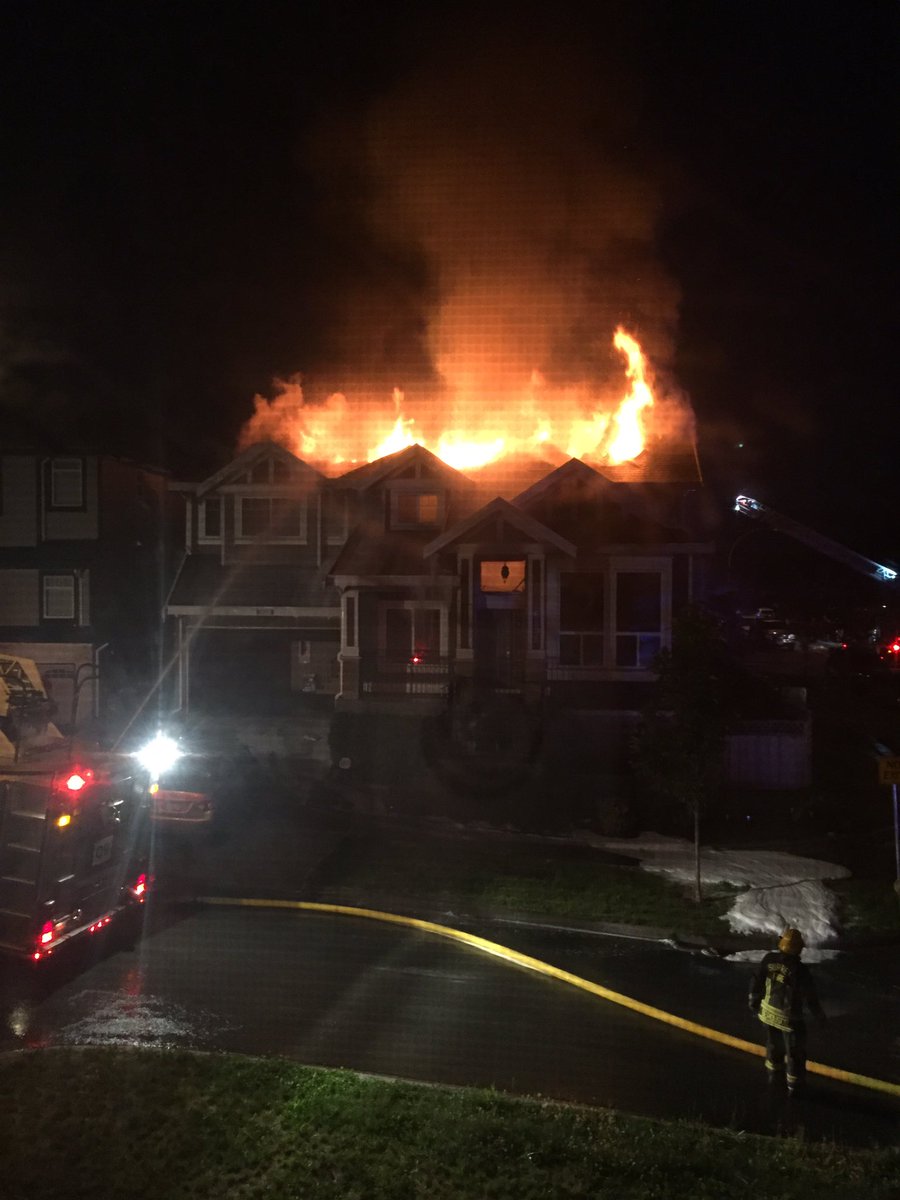 The house across the street is on fire