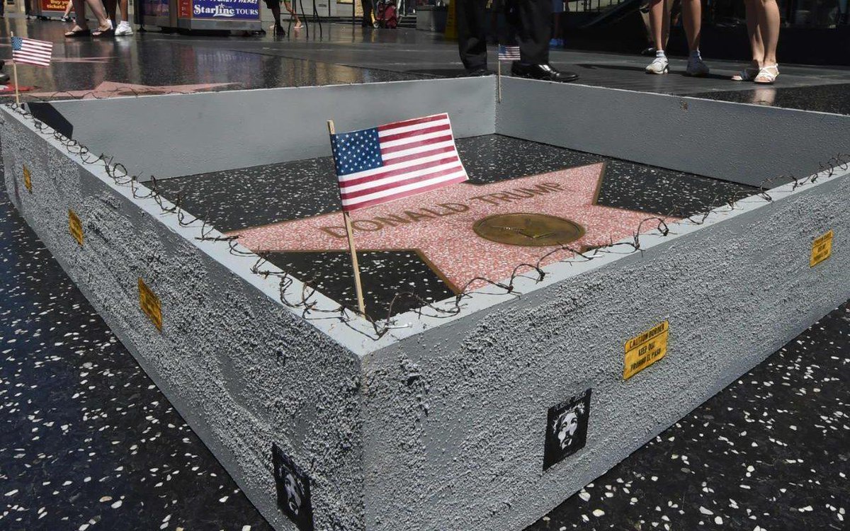 Telegraph's tweet image. Tiny wall appears around Donald’s Trump’s star on Hollywood Walk of Fame http://www.teleg... telegraph.co.uk/news/2016/07/2…