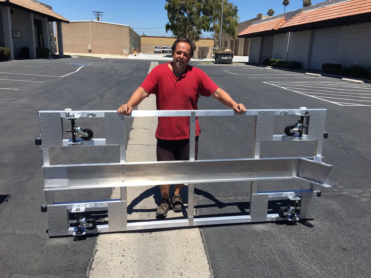 Weighs 98 pounds, a bit heavier, but extremely strong and secure. Not me in the photo. It's Gary the engineer.