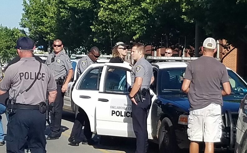 benfelder_okc's tweet photo. Here is a pic of Sovereign Citizens man being arrested after being found with smoke bombs. #BLMOK2016 https://t.co/9hHxtNwyZT