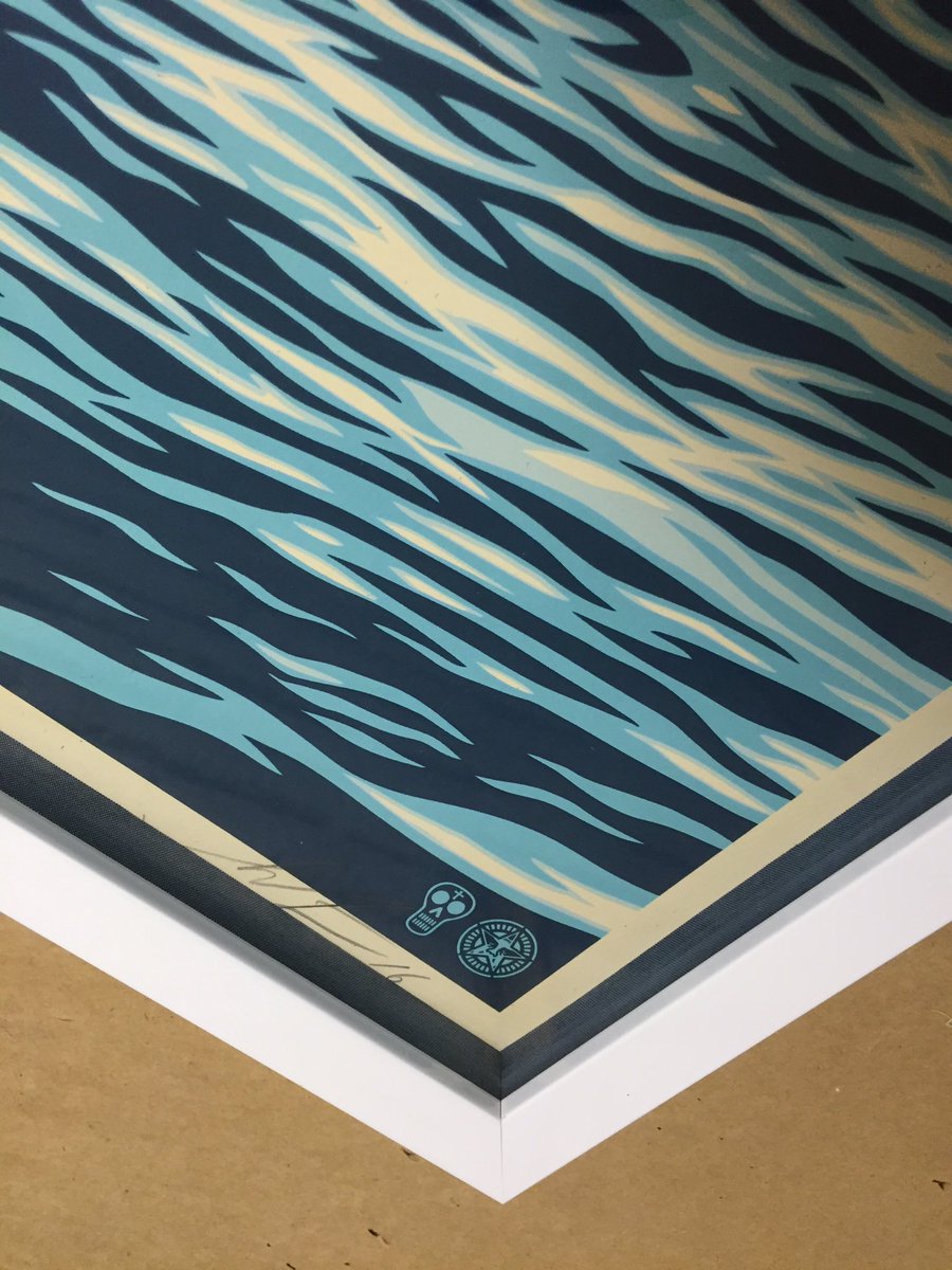 FrameWorksAZ's tweet image. Blue fabric matboard spacers &amp;amp; gloss white frame for a clean look on this recent #shepardfairey release #justframed