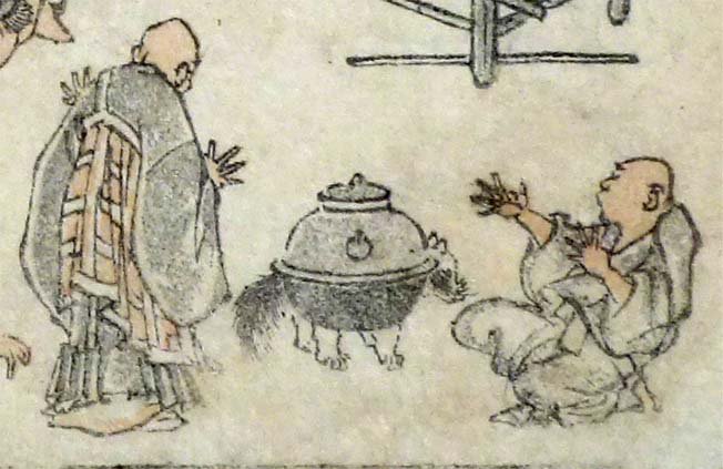 分福茶釜。お坊さんたちが手を広げて驚いているのに対し、正体を現した