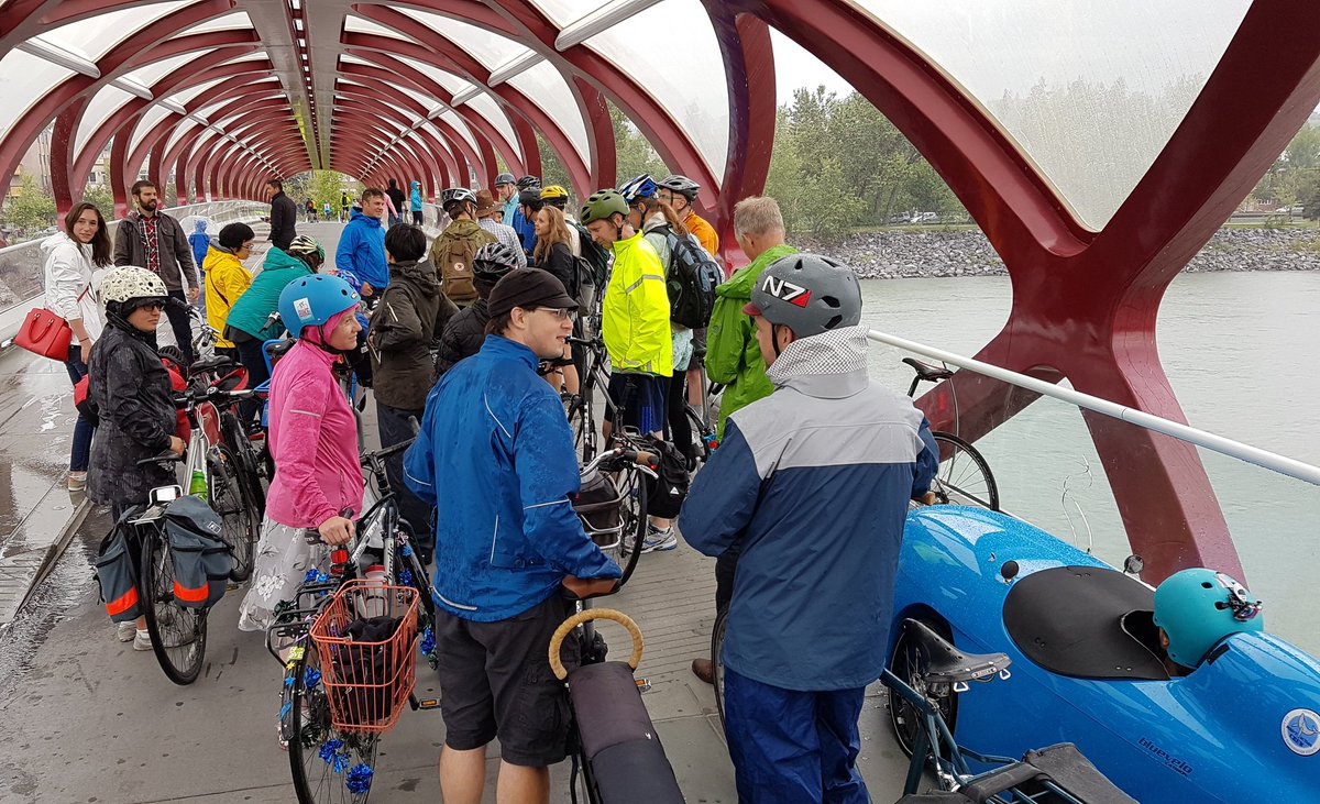 BikeBikeYYC's tweet image. Hiding from the downpour. #RideWithShannon @SPhillipsAB @bikecalgary @take5tenfour @Cyclepalooza #yycbike
