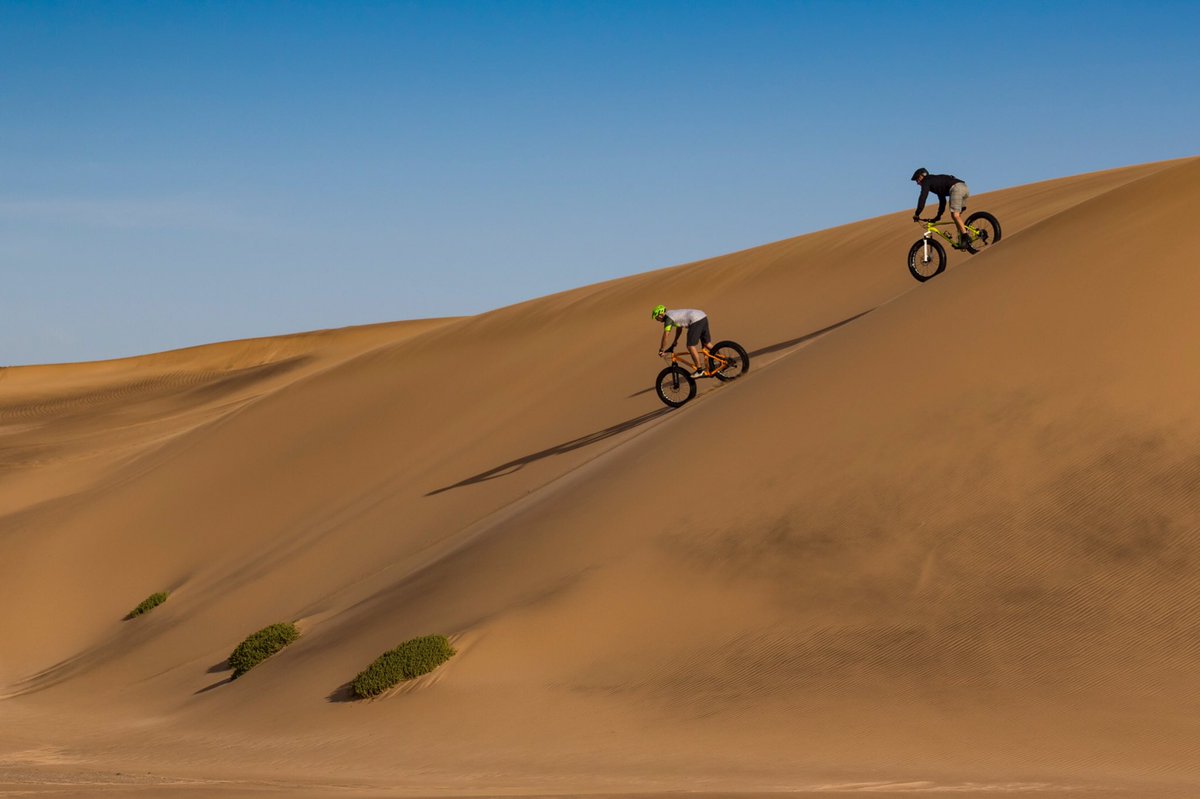 N0madAdv's tweet photo. Namibia dunes are a happy place for fat bikes. @SpecializedZA https://t.co/FxMZpXzvek