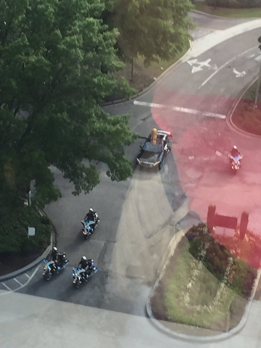 JayPhilips1075's tweet photo. Nick Saban arrives at #SECMD16. He gets four motorcycle cops! (Sorry for the reflection in the window!) https://t.co/0d5ufwHXkr