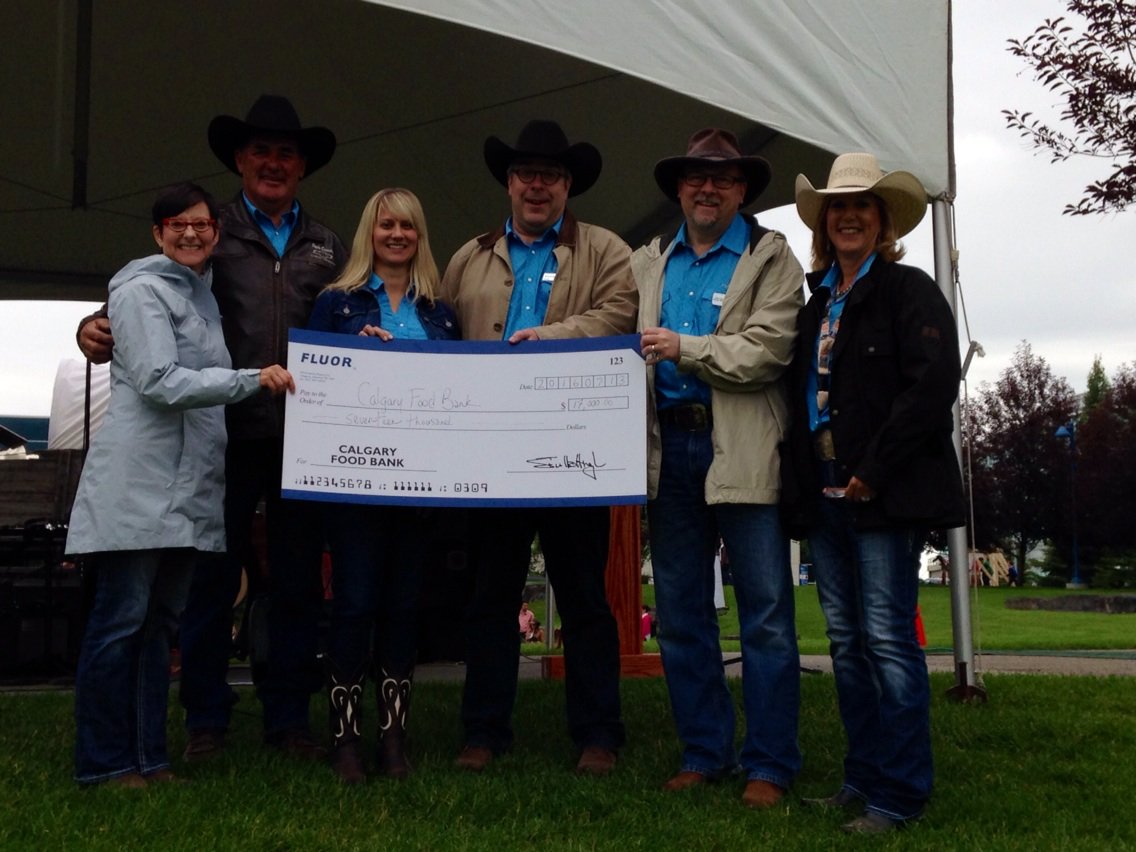 fluorcanada's tweet photo. Honoured to donate $17k to @CalgaryFoodBank at our Stampede Breakfast for #putthebootstohunger #iboothunger https://t.co/Tirjpw4lSO