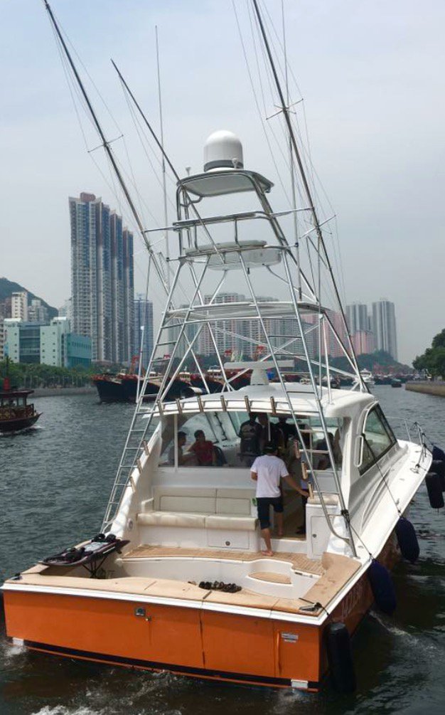 HatterasYachts's tweet photo. The #45Express with the custom orange hull has reached its final destination: China. https://t.co/iK60qbA8se