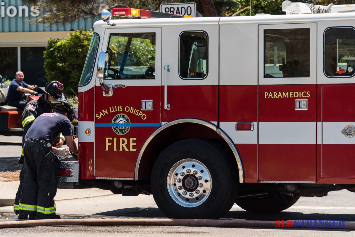 SLOStringer's tweet photo. #SanLuisObispo #SLOFD knocks down involved motorhome fire, no injuries. Prado Road 1PM. E2 w/ #ThinBlueLine on door! https://t.co/xqoovhFnwP