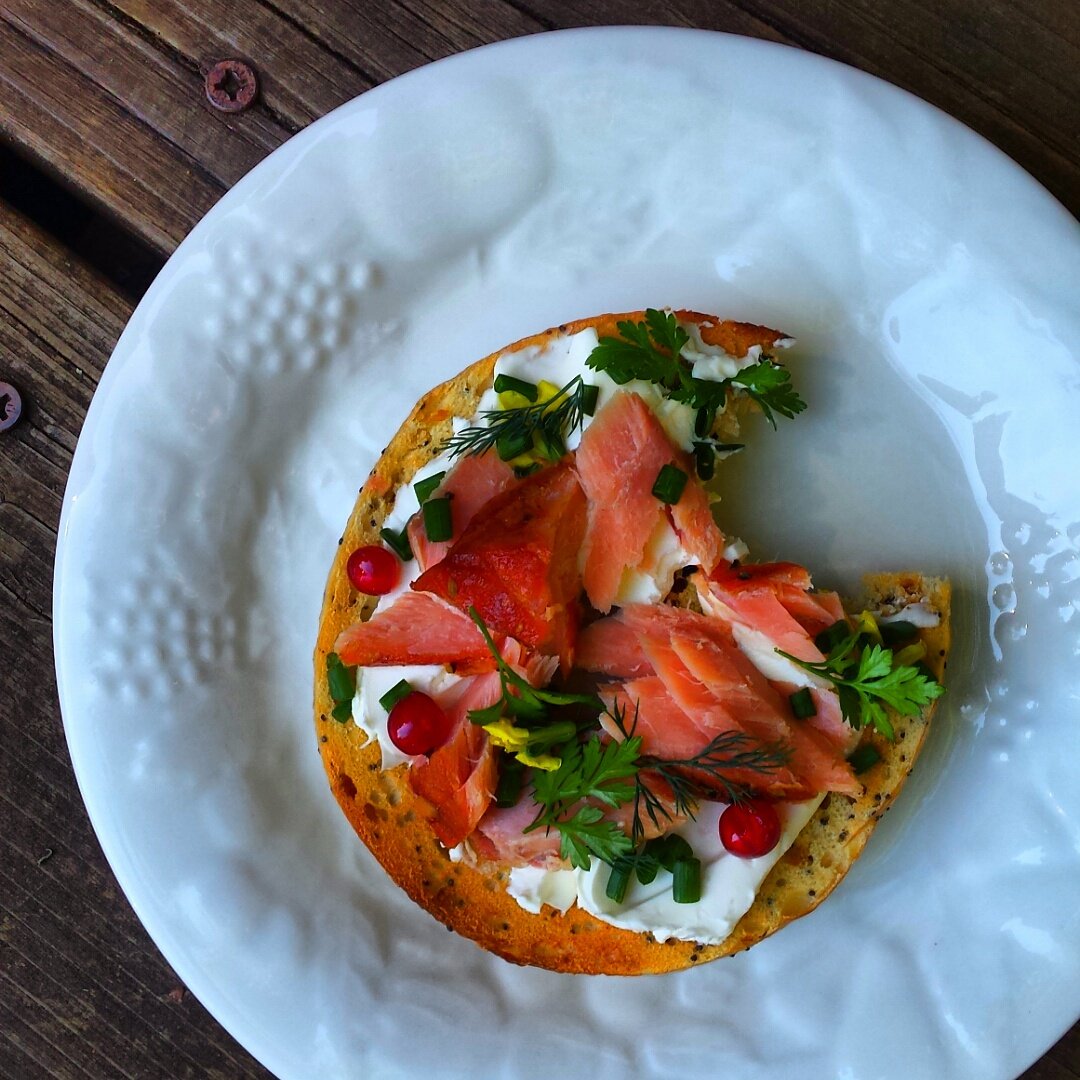 pacific northwest breakfast of champions... toasted bagel, homemade ricotta, smoked wild coho salmon + red currants.