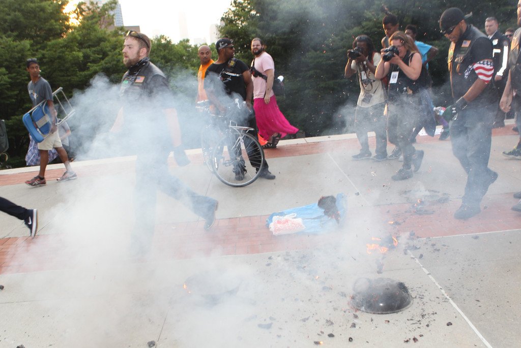 realkingrobbo's tweet photo. Weenies burn flag to protest cops, get attacked by bikers, need cops to save their asses https://t.co/Ag50rFYqM3 https://t.co/tmM9De7m9R
