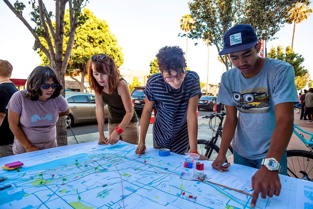 EmpactLB's tweet photo. @BikeUptown youth academy participating in LB BMP outreach at First Fridays in Bixby Knolls #bikeuptown #empactlb https://t.co/VIWhx7W8j2