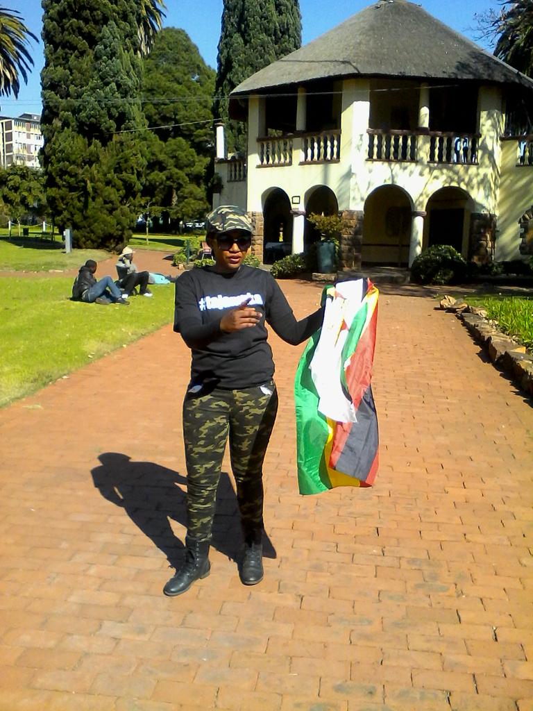 mufcqueen's tweet photo. #thisflag #ZimSolidarity #tajamuka .This land our land is our Zimbabwe ....singing https://t.co/AZurffd2yC